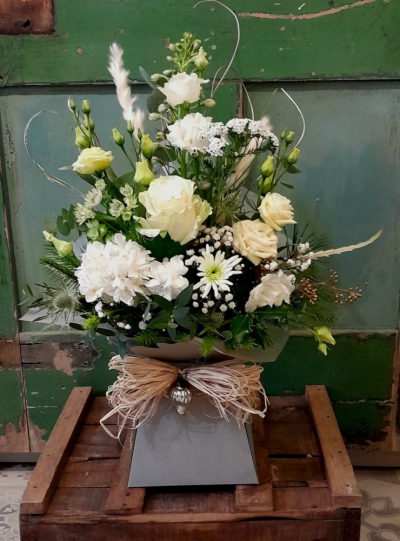 Ivory Box Arrangement - What a stunner this arrangement is. Created in a front facing style, it will sit nicely on a sideboard or side table.