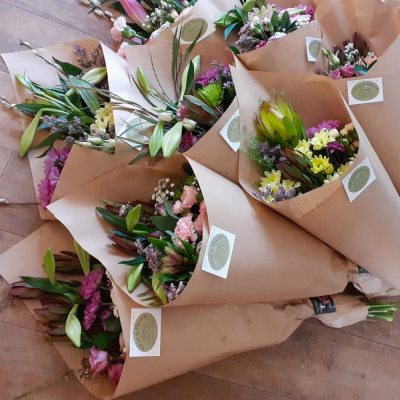 Flowers in Kraft Paper - Mixed flowers in paper wrap. We are able to choose some fresh and seasonal mixed flowers for this gift.