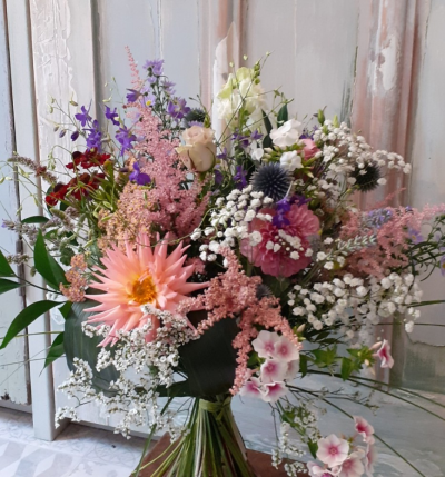 Mixed Pastel Hand Tied - Mixed pastel colours go in to create this cheery, tied bunch. We will choose a wide variety of pretty flowers and delicate foliage's and arrange them in a relaxed and natural style.